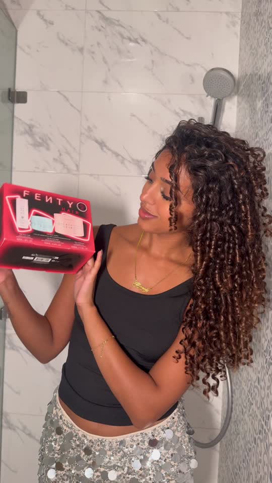 Holiday glow-up, incoming! 🎁 @afsaanah | THE CURLY GIRL lights up the szn with shiny, defined curls that turn heads + keep moisture on lock. 💡✨ The Rich Curls Holiday Set ($48, for $63 value) is your 3-step routine to hydrated, frizz-proof, holiday-party-ready curls! 🪩 💧The Rich One Moisture Repair Shampoo delivers a lush lather + gentle cleanse that cleans the hair without stripping 💦 The Richer One Deep Conditioner is ultra-rich + melts right in to curls for a total moisture moment 💫 The Homecurl Curl-Defining Cream is a silicone-free, award-winning gel-cream that serves hold + bounce Curls stay healthy + wealthy on Fenty. Shop now @sephora, @sephoracanada, #sephoraxkohls at @Kohl’s and fentyhair.com! 🛍️