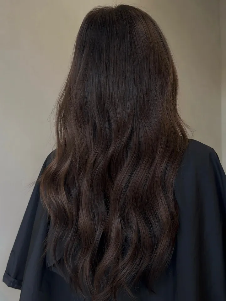 Real client wearing Premium Pro Wefts, back view showing a full seamless blend